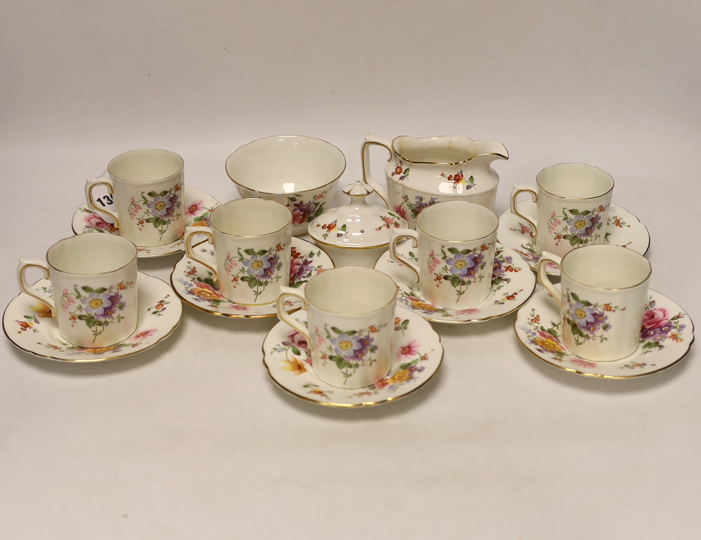A Royal Crown Derby Posies coffee set comprising of seven cups and saucers, a sugar bowl and milk jug